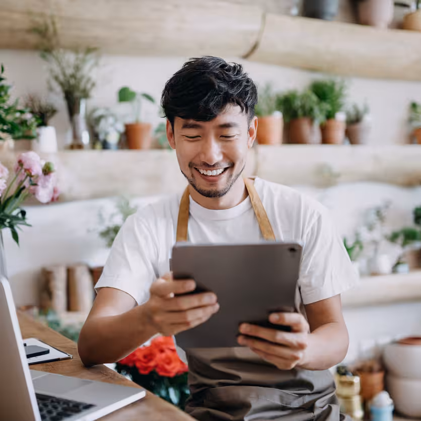 shop-owner-working-on-tablet